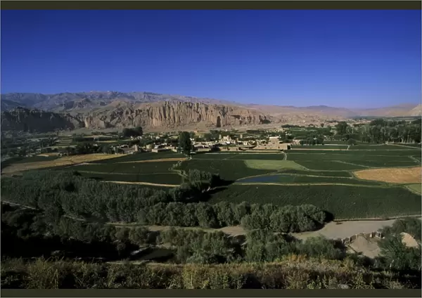 View of Bamiyan showing cliffs with two empty niches where the famous carved Buddhas stood
