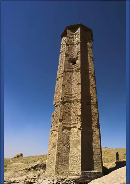 Man looking at Minaret of Bahram Shah one of two early 12th century minarets