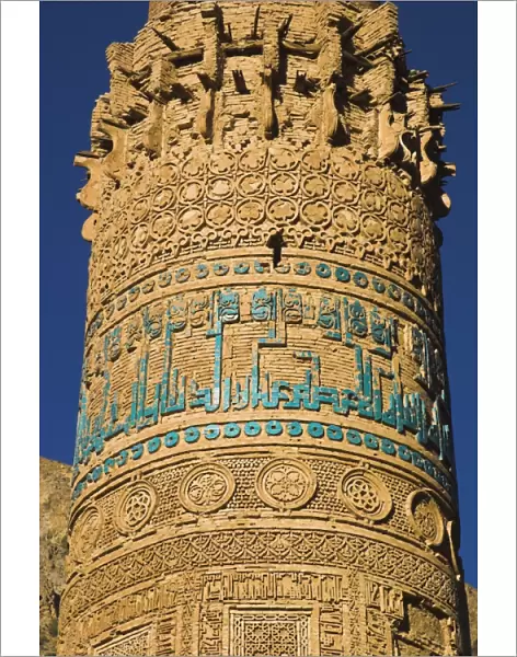 Detail of decoration on minaret including Kufic inscription in turquoise glazed tiles