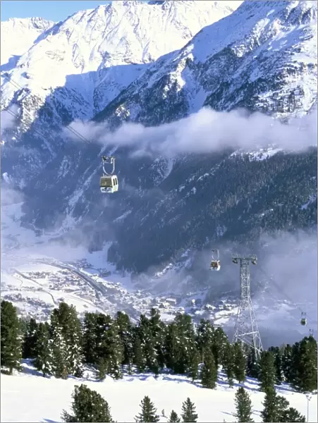 Gondolas rising above village of Solden in Tirol Alps, Tirol, Austria, Europe