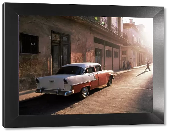 Early morning street scene with classic American car, Havana, Cuba, West Indies