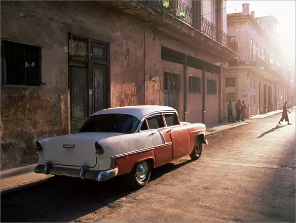 Early morning street scene with classic American car, Havana, Cuba, West Indies