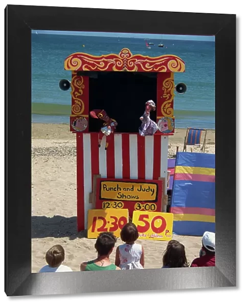 Punch & Judy show on the beach at Swanage, Dorset, England, United Kingdom, Europe
