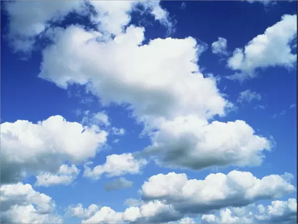 Puffy white clouds in a blue sky in England, United Kingdom, Europe