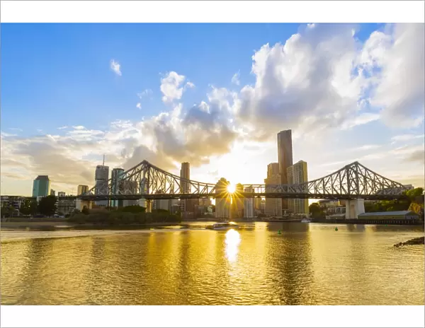 Sunset, Brisbane city with the sun hidden behind the Story Bridge, Brisbane, Queensland