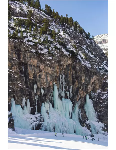 Skiers underneath the frozen waterfall, Hidden Valley ski area, Lagazuoi, Armentarola 101