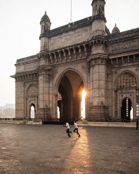 Sunrise behind The Gateway to India, Mumbai (Bombay), India, South Asia