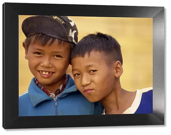 Portrait of two boys of the Akha hill tribe in western