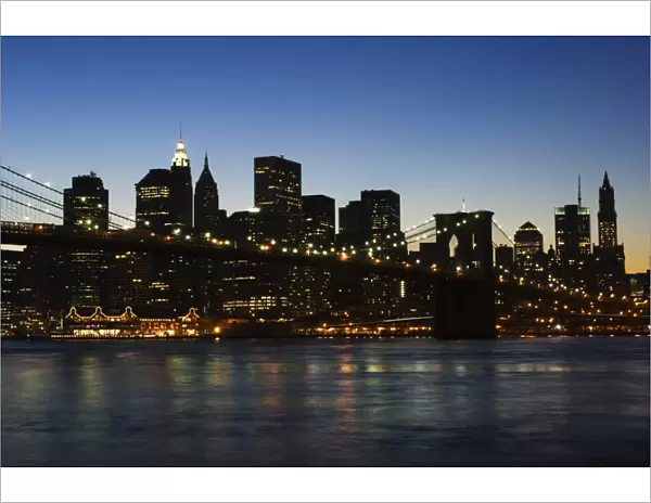 Manhattan skyline and Brooklyn Bridge at dusk