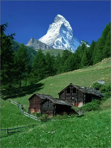 The Matterhorn towering above green pastures