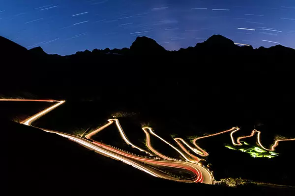 Star trail on the lights of car trace at Stelvio Pass, Valtellina, Lombardy, Trentino Alto Adige