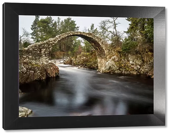 The old packhorse bridge built in 1717 over the River Dulnain in the village of Carrbridge