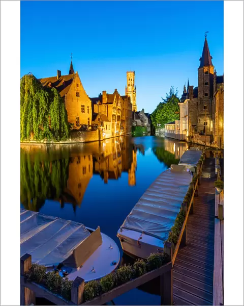 The beautiful buildings of Bruges reflected in the still waters of the canal, UNESCO