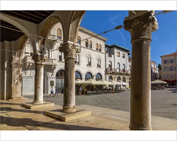 View of cafes from arches of the Town Hall in Forum Square, Pula, Istria County, Croatia