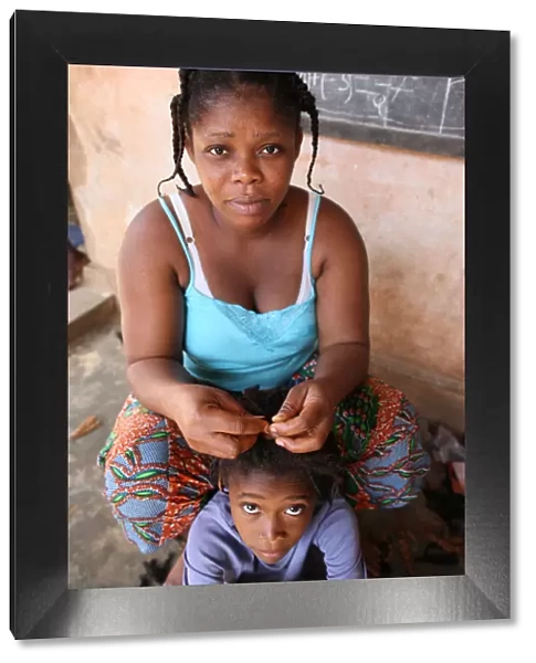 Hairdresser at home, Lome, Togo, West Africa, Africa