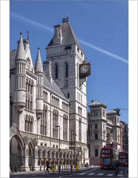 The Royal Courts of Justice, Central Civil Court, and red London bus on Fleet Street