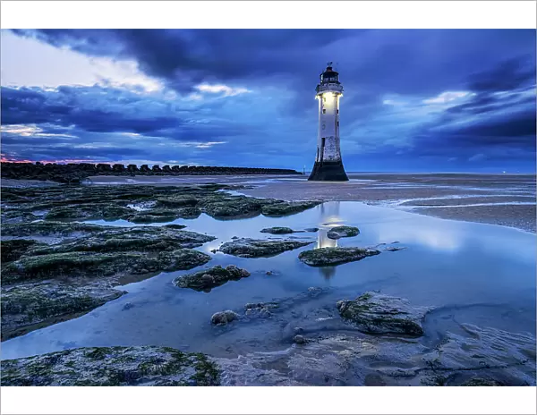 Perch Rock Lighthouse and the sands of New Brighton at twilight, New Brighton, The Wirral, Merseyside, England, United Kingdom, Europe