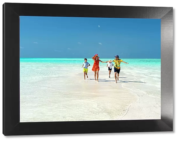 Family with two boys having fun running together on idyllic beach, Zanzibar, Tanzania, East Africa, Africa