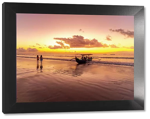View of fishing outrigger on Kuta Beach at sunset, Kuta, Bali, Indonesia, South East Asia, Asia