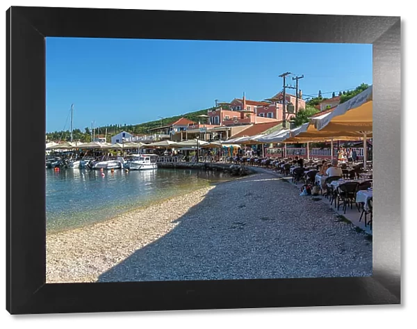 View of cafes and restaurants in Fiscardo harbour, Fiscardo, Kefalonia, Ionian Islands, Greek Islands, Greece, Europe