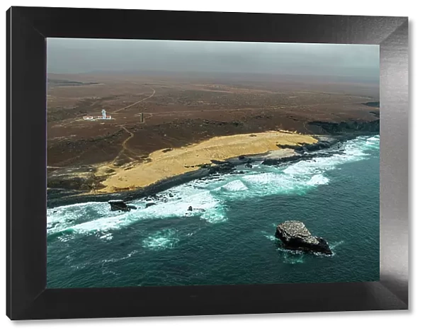 Aerial of the wild coastline with basalt pools on the Atlantic coastline, Dombe Grande, Namibre, Angola, Africa
