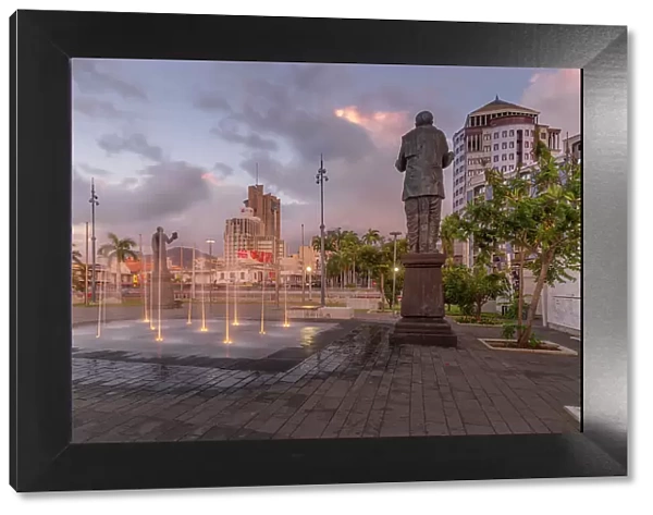 View of statue in Caudan Waterfront in Port Louis at dusk, Port Louis, Mauritius, Indian Ocean, Africa