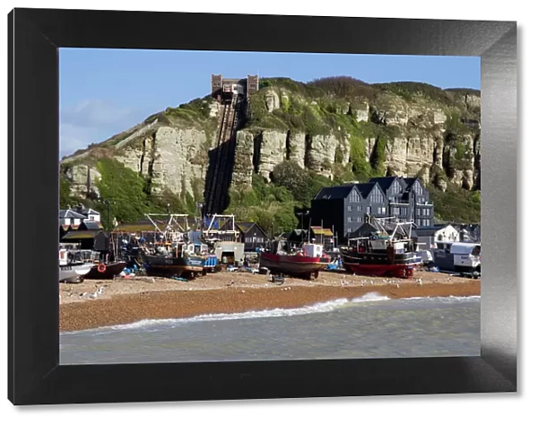 Fishing fleet drawn up on beach and East Hill lift, Hastings, Sussex, England, United Kingdom, Europe