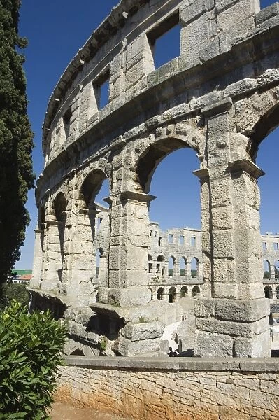 The 1st century Roman amphitheatre, columns and arched walls, Pula, Istria