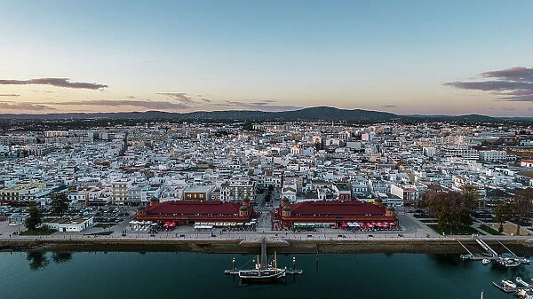Aerial drone view of Olhao, officially known as Olhao da Restauracao, a city and municipality in the Algarve region, southern Portugal, Europe