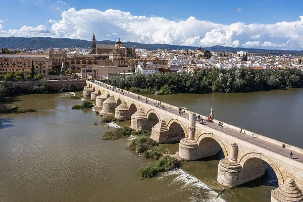 Aerial of the Historic Roman Bridge over the Guadalquivir River, UNESCO World Heritage Site, Cordoba, Andalusia, Spain, Europe