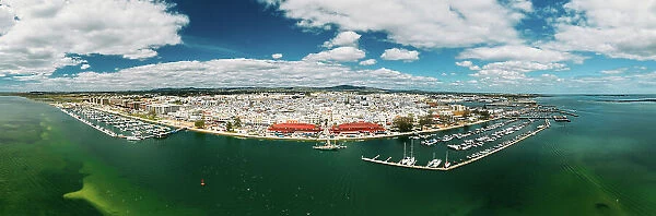 Aerial panoramic drone view of Olhao, officially known as Olhao da Restauracao, a city and municipality in the Algarve region, southern Portugal, Europe