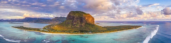 Aerial panoramic of Le Morne Brabant peninsula and turquoise coral reef at sunset