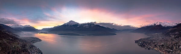 Aerial panoramic view of Gravedona and Domaso towns on shores of Lake Como at sunrise
