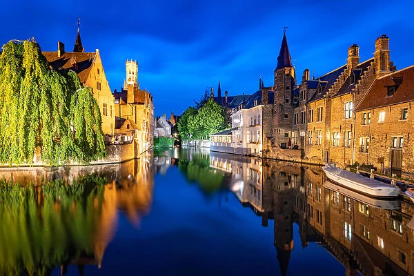 The beautiful buildings of Bruges reflected in the still waters of the canal, UNESCO