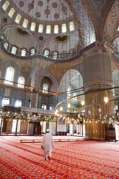 Blue Mosque interior, UNESCO World Heritage Site, mullah in foreground, Istanbul