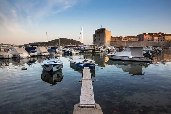 Boats in Dubrovnik harbour during sunset, Dubrovnik, Croatia, Europe