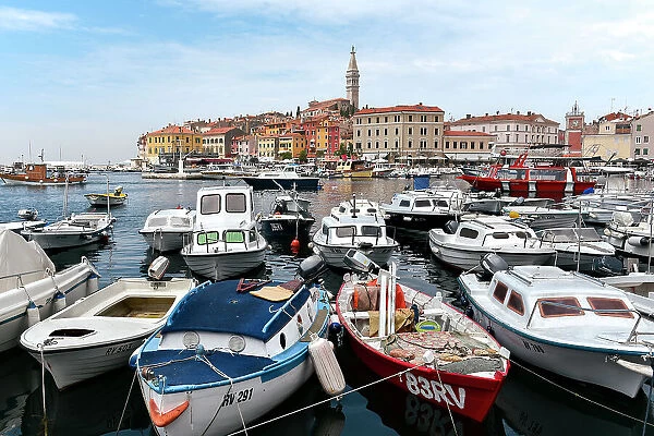 Boats in the harbor overlooking the old town of Rovinj, Croatia, Europe