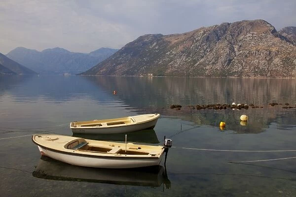Boats moored in the fjord at Kotor Bay, Kotor, UNESCO World Heritage Site