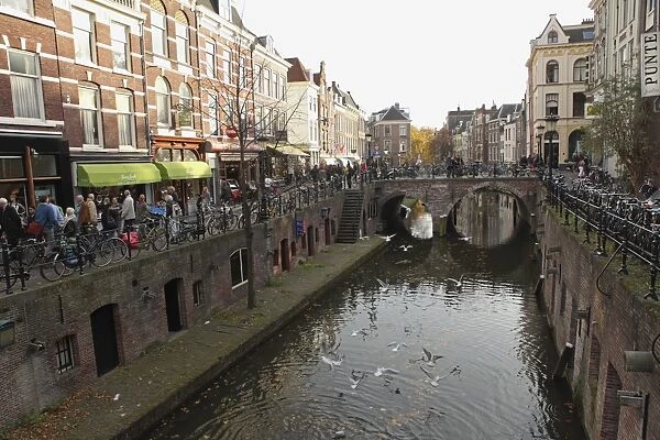 The busy Vismarkt shopping street runs along the Oudegracht canal in Utrecht