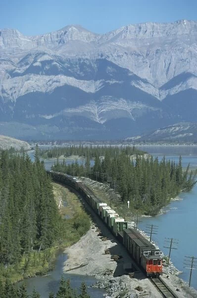 Canadian National Railways goods train along Athabasca River, Jasper National Park
