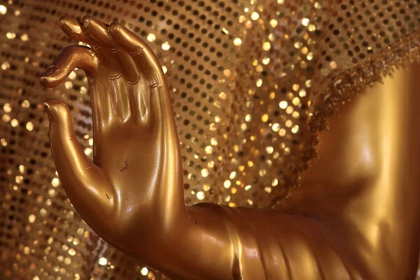 Close-up of a hand of golden Buddha statue, Wat Simuong (Wat Si Muang), Vientiane, Laos
