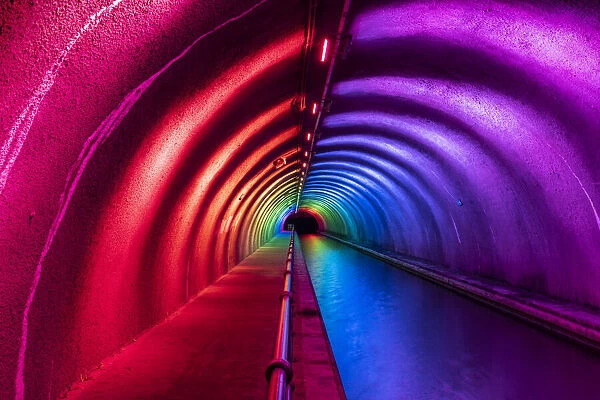 Colourful illuminated interior of the Roughcastle Tunnel at night, Edinburgh and Glasgow Union Canal, Falkirk, Scotland, United Kingdom, Europe