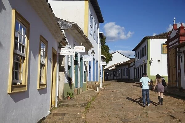 Couple walking along street, Tiradentes, Minas Gerais, Brazil, South America