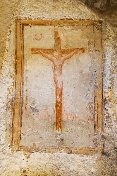 Crucifix fresco in a cave church in the Sassi area of Matera, Basilicata, Italy, Europe
