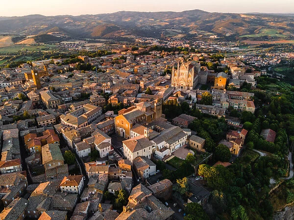 Drone view of Orvietos Old Town cityscape at sunset, Orvieto, Umbria, Italy, Europe