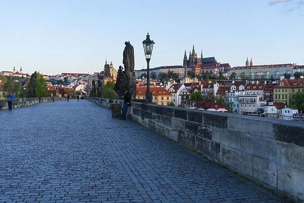 Early morning on Charles Bridge looking towards Prague Castle and Hradcany, UNESCO