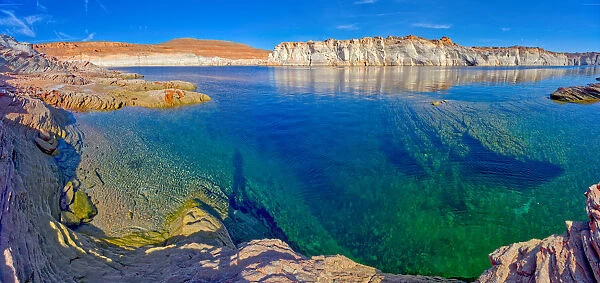 The emerald blue waters of Lake Powell just north of the Glen Canyon Dam in an area