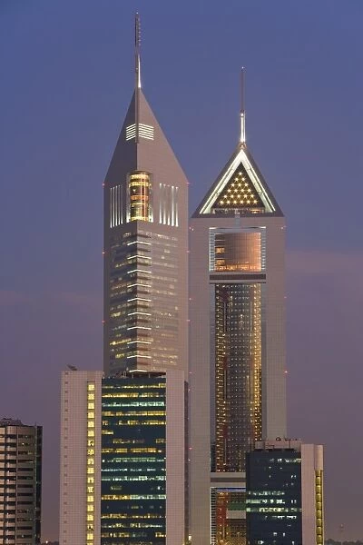 Emirates Towers on Sheikh Zayed Road illuminated at dusk