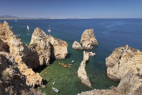 Excursion boats at Ponta da Piedade Cape, near Lagos, Algarve, Portugal, Europe