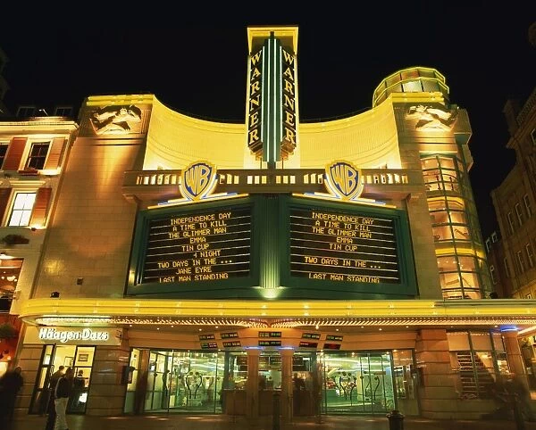 Exterior of the Warner Cinema illuminated at night, Leicester Square, London